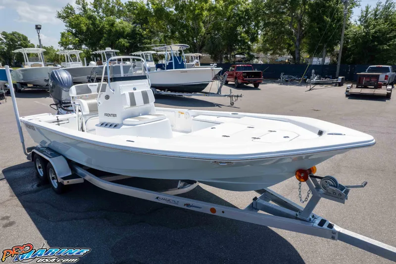 Slide: The Image of 2025 Frontier 2104 boat on trailer in sunny outdoor setting. - 21