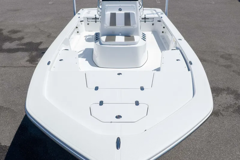 Slide: The Image of 2025 Frontier 2104 boat, white deck, spacious layout, modern design, parked on asphalt. - 6