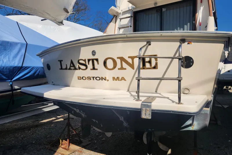 Slide: The Image of 1987 Luhrs 40 Convertible boat named "Last One" docked in Boston, MA. - 28