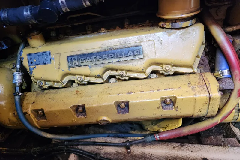 Slide: The Image of Caterpillar engine in a 1987 Luhrs 40 Convertible boat, showing hoses and components. - 45