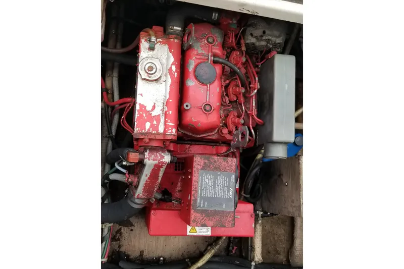 Slide: The Image of Engine of a 1987 Luhrs 40 Convertible boat, featuring red components and visible wiring. - 7