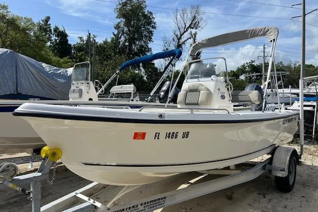 The Image of 2025 Key West 1720 Center Console boat on trailer, parked outdoors. - 0