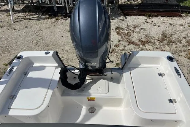 Slide: The Image of 2025 Key West 1720 Center Console boat with outboard motor, viewed from above. - 2
