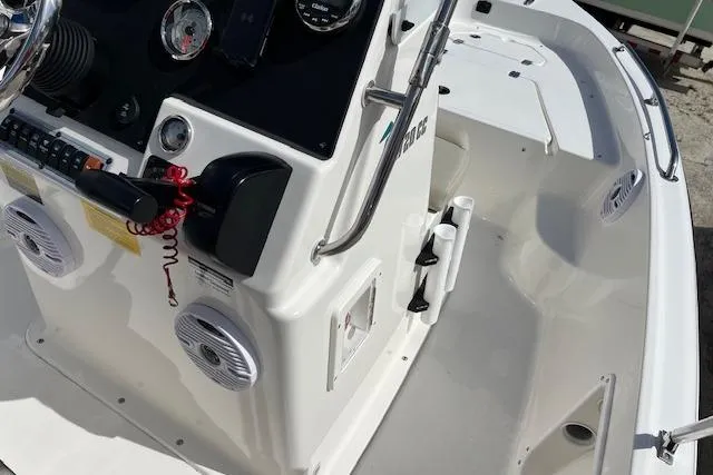 Slide: The Image of 2025 Key West 1720 Center Console boat interior with steering console and speakers. - 5