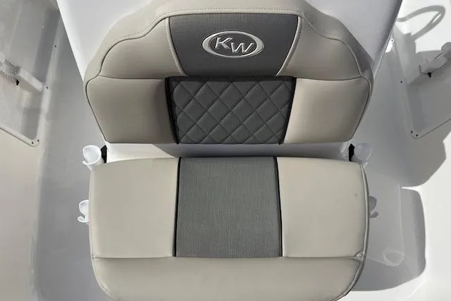 Slide: The Image of 2025 Key West 1720 Center Console boat seat with KW logo, featuring gray and beige upholstery. - 7