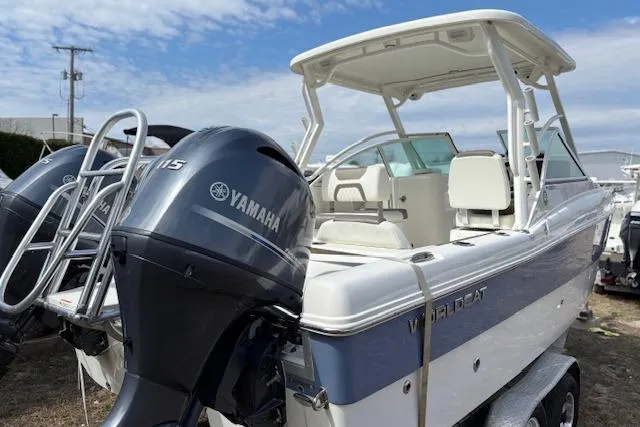 Slide: The Image of 2023 World Cat 230 DC boat with Yamaha engine, docked outdoors. - 12