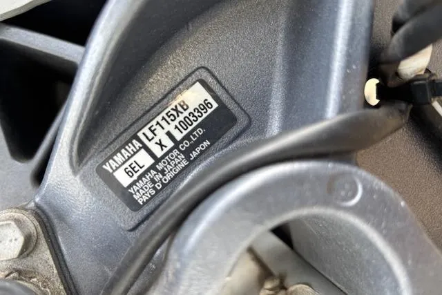 Slide: The Image of Close-up of Yamaha LF115XB engine label on 2023 World Cat 230 DC boat. - 16