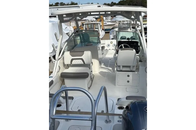 Slide: The Image of 2023 World Cat 230 DC boat interior with seating and steering console. - 5