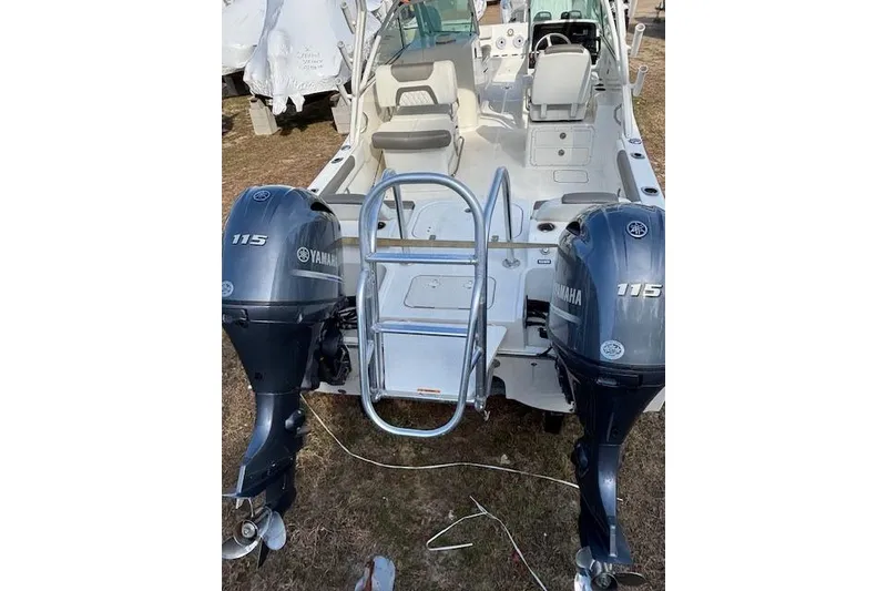 Slide: The Image of 2023 World Cat 230 DC boat with dual Yamaha 115 engines, rear view. - 8