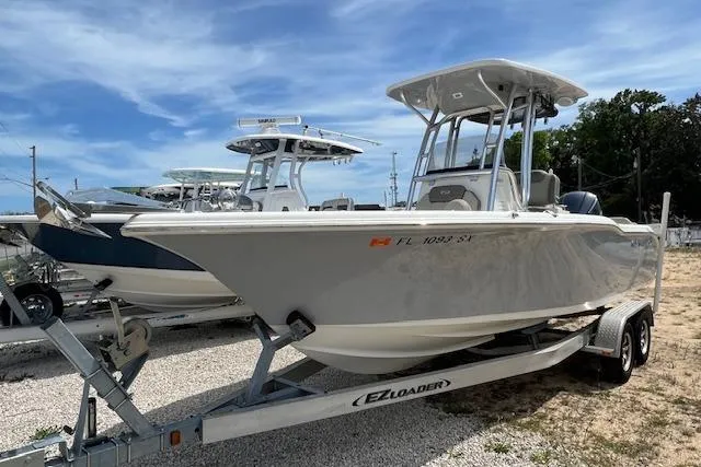 The Image of 2021 Key West 239 FS boat on EZ Loader trailer, parked outdoors. - 0