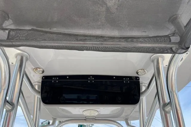 Slide: The Image of 2021 Key West 239 FS boat T-top with rod holders and storage net. - 13