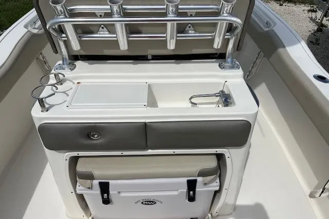 Slide: The Image of 2021 Key West 239 FS boat interior with rod holders and storage compartments. - 3