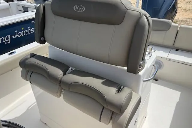 Slide: The Image of 2021 Key West 239 FS boat with comfortable gray seating and sleek design. - 4