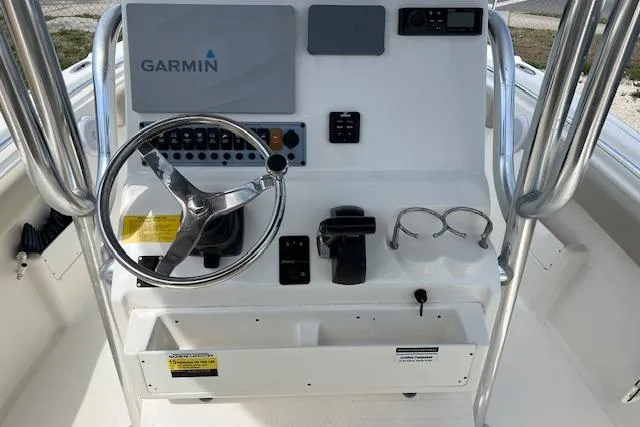 Slide: The Image of 2021 Key West 239 FS boat console with Garmin navigation system and steering wheel. - 5