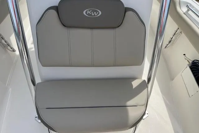 Slide: The Image of 2021 Key West 239 FS boat seat with gray upholstery and KW logo. - 7