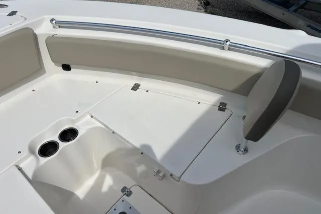 Slide: The Image of Interior view of a 2021 Key West 239 FS boat, featuring seating and cup holders. - 8