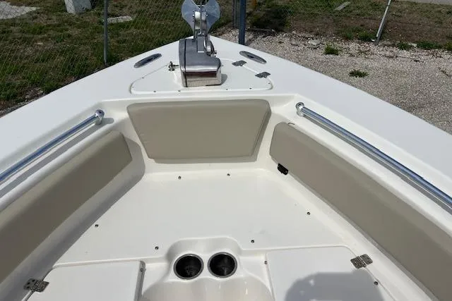 Slide: The Image of 2021 Key West 239 FS boat bow with seating and anchor, viewed outdoors. - 9