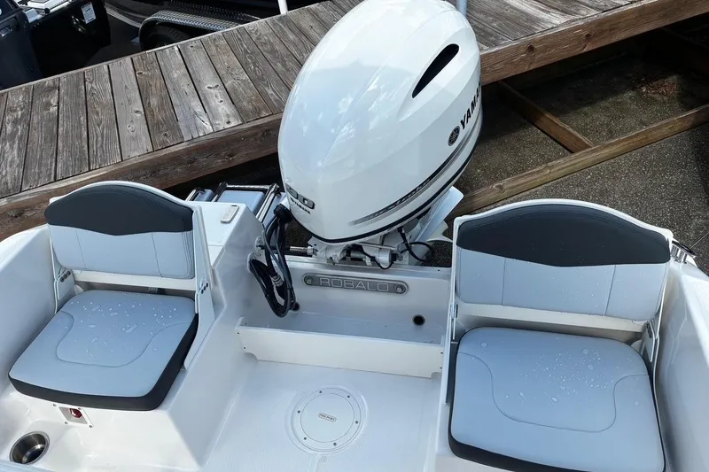Slide: The Image of 2026 Robalo R160 Center Console boat with Yamaha engine, featuring dual seating and sleek design. - 4