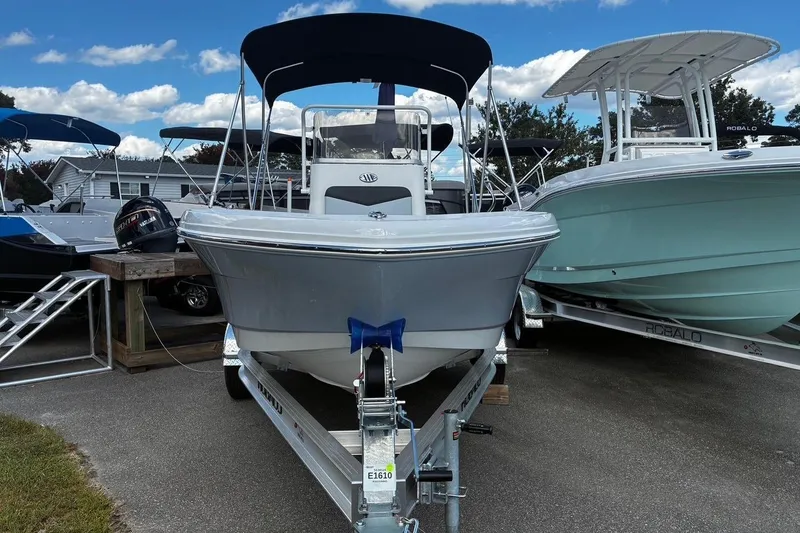 Slide: The Image of 2026 Robalo R160 Center Console boat on trailer, displayed outdoors. - 6