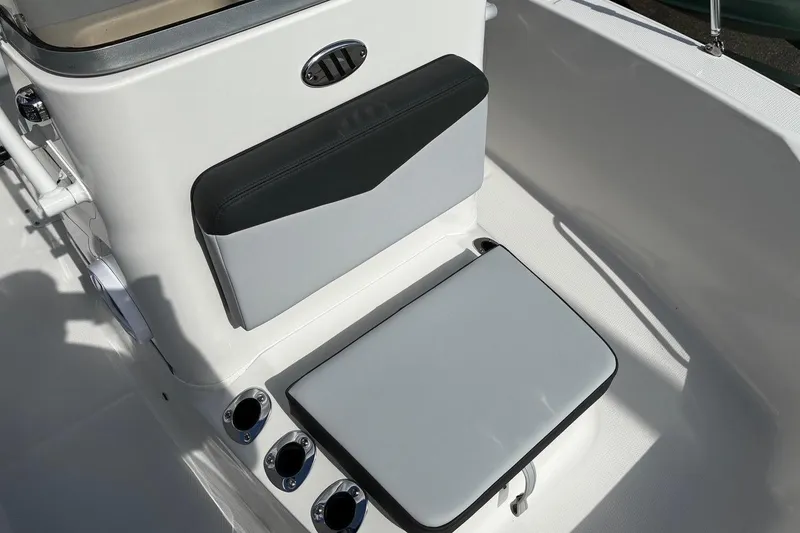Slide: The Image of 2026 Robalo R160 Center Console boat seating and rod holders. - 8