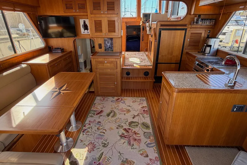 Slide: The Image of Interior of 2020 Helmsman Trawlers 38E with wood finish and modern amenities. - 3