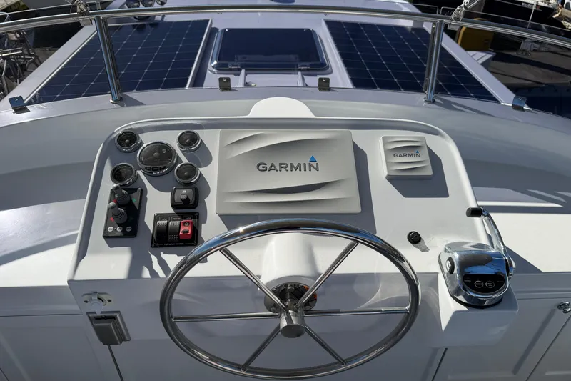 Slide: The Image of Helmsman Trawlers 38E 2020 helm with Garmin navigation and control panel. - 33