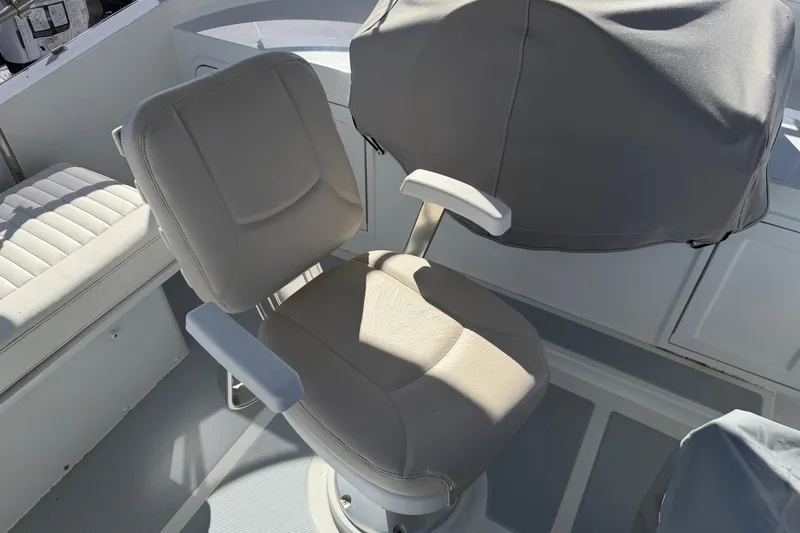Slide: The Image of Helmsman Trawlers 38E 2020 helm seat and covered controls on deck. - 35