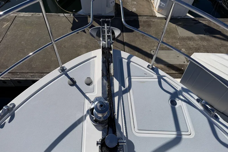 Slide: The Image of Bow of 2020 Helmsman Trawlers 38E with anchor and railing at dock. - 46