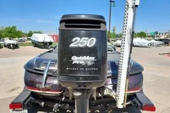 Slide: The Image of 2011 Nitro Z-8 boat with OptiMax Pro 250 engine in a parking lot. - 10