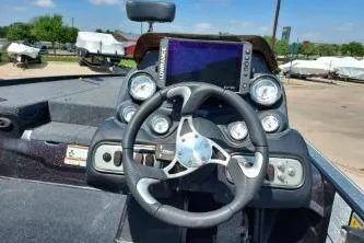 Slide: The Image of Steering console of a 2011 Nitro Z-8 boat with gauges and navigation screen. - 11