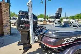 Slide: The Image of 2011 Nitro Z-8 boat with Mercury Pro XS engine, parked outdoors. - 2