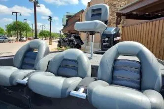 Slide: The Image of 2011 Nitro Z-8 boat with gray seating and outdoor background. - 5