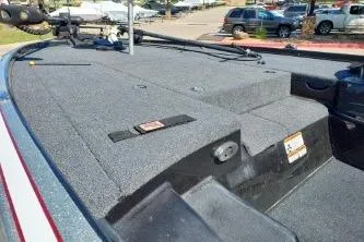 Slide: The Image of 2011 Nitro Z-8 boat deck with carpeted surface and storage compartments. - 6