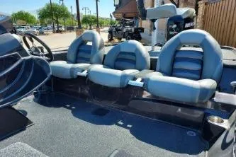 Slide: The Image of 2011 Nitro Z-8 boat interior with three cushioned seats and steering console. - 8