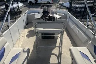 Slide: The Image of 2023 Suntracker G3 Select 322 CC pontoon boat interior with seating and steering console. - 10