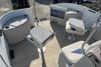 Slide: The Image of 2023 Suntracker G3 Select 322 CC boat interior with seating and helm. - 12