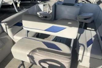 Slide: The Image of 2023 Suntracker G3 Select 322 CC boat interior with seating and steering wheel. - 8