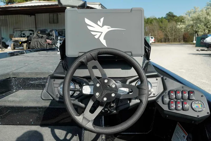 Slide: The Image of Steering console of 2026 Skeeter ZXE21 boat with control panel and logo. - 11