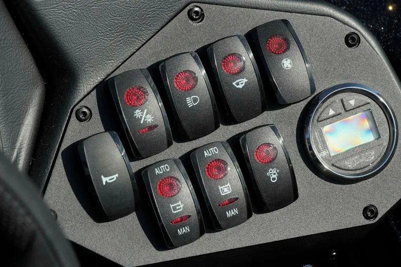 Slide: The Image of Control panel of 2026 Skeeter ZXE21 with various switches and digital display. - 12