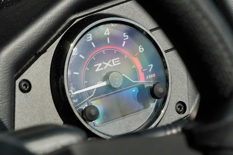 Slide: The Image of Close-up of 2026 Skeeter ZXE21 tachometer displaying RPM gauge. - 13