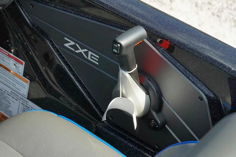 Slide: The Image of Control panel of 2026 Skeeter ZXE21 boat with throttle lever. - 14