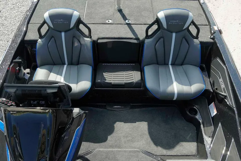 Slide: The Image of Interior of 2026 Skeeter ZXE21 boat with dual gray seats and modern dashboard. - 16