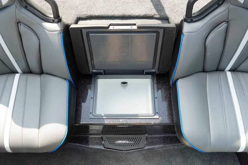 Slide: The Image of Interior of 2026 Skeeter ZXE21 boat with open storage compartment between seats. - 18