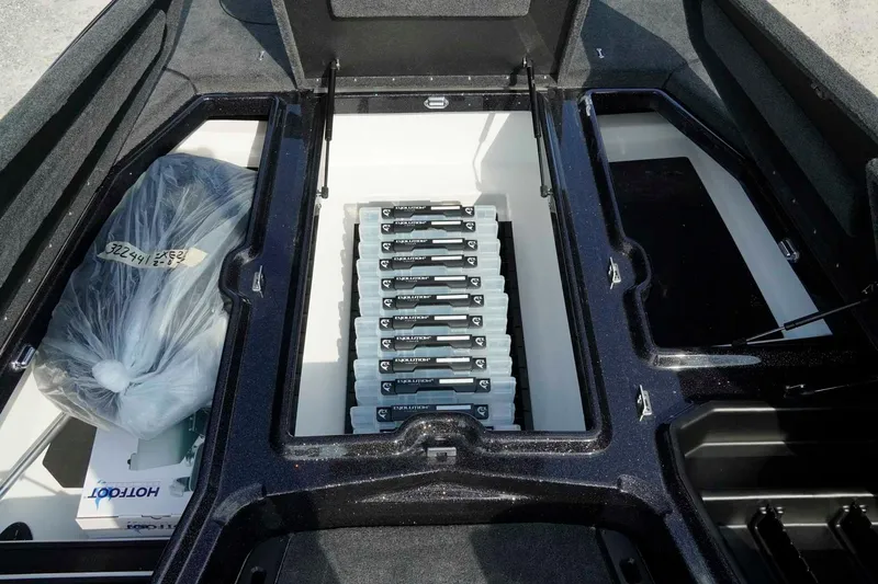 Slide: The Image of Storage compartment of 2026 Skeeter ZXE21 boat with organized equipment and accessories. - 20