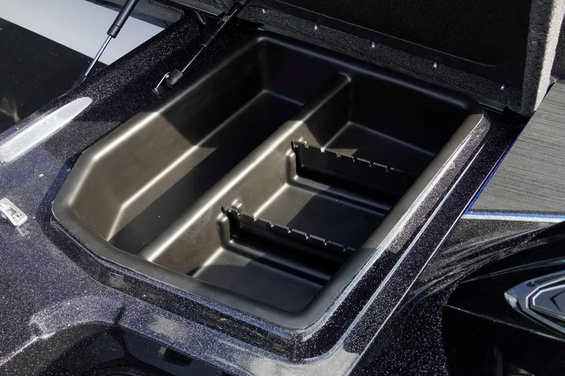 Slide: The Image of Open storage compartment of 2026 Skeeter ZXE21 boat, showcasing interior design. - 21