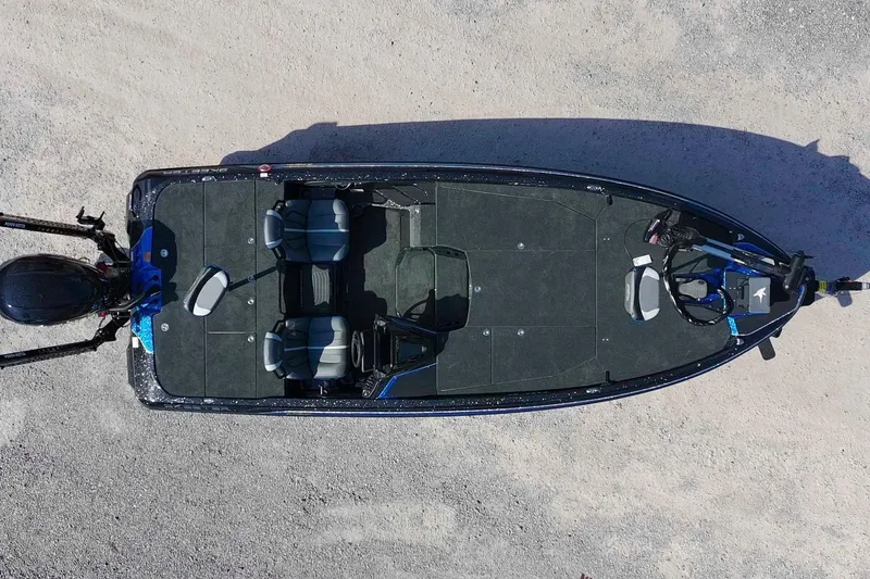 Slide: The Image of Top view of a 2026 Skeeter ZXE21 boat on a gravel surface. - 3