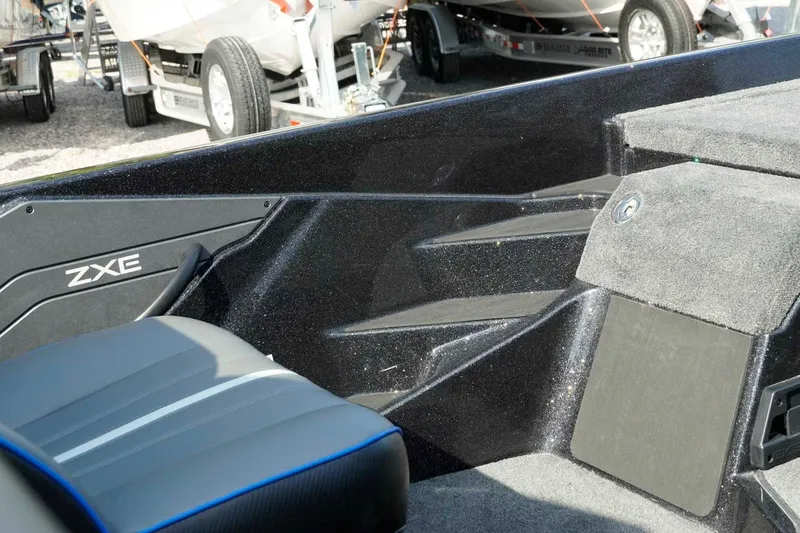 Slide: The Image of Interior view of 2026 Skeeter ZXE21 boat, featuring sleek seating and storage compartments. - 31