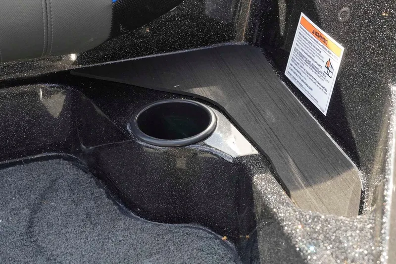 Slide: The Image of Interior of 2026 Skeeter ZXE21 boat featuring a cup holder and warning label. - 32