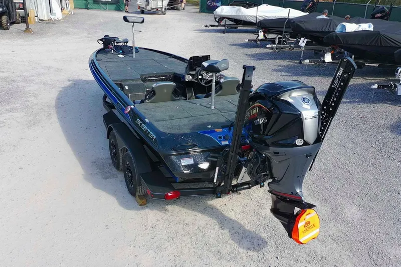 Slide: The Image of 2026 Skeeter ZXE21 fishing boat with Yamaha outboard motor on a trailer. - 6