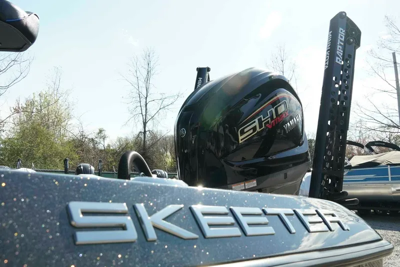 Slide: The Image of 2026 Skeeter ZXE21 boat with Yamaha SHO engine, outdoors in sunlight. - 7